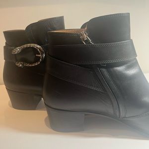 Black Gucci booties: wrap around leather strap & silver tiger/lion hardware